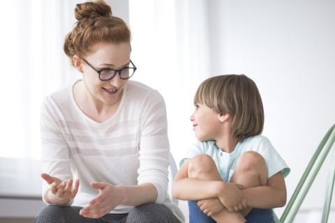 Woman sitting with young boy